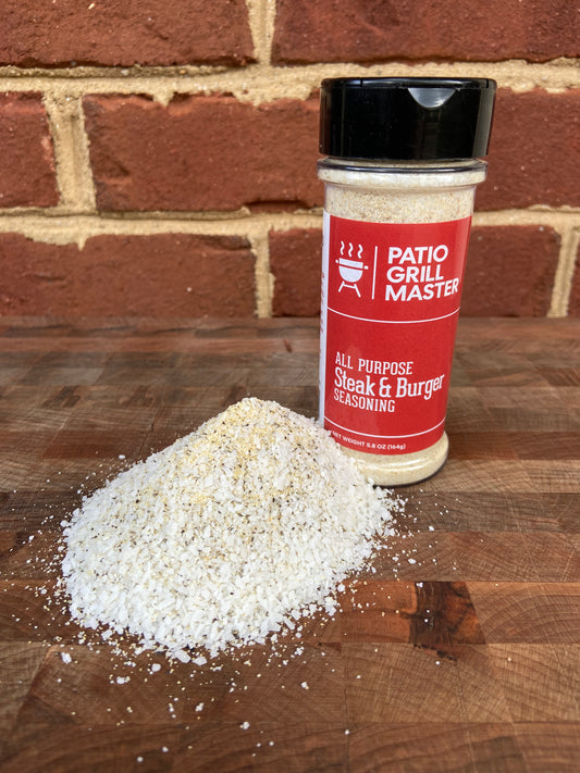 Patio Grill Master All Purpose Steak and Burger Seasoning jar with grilled steak.